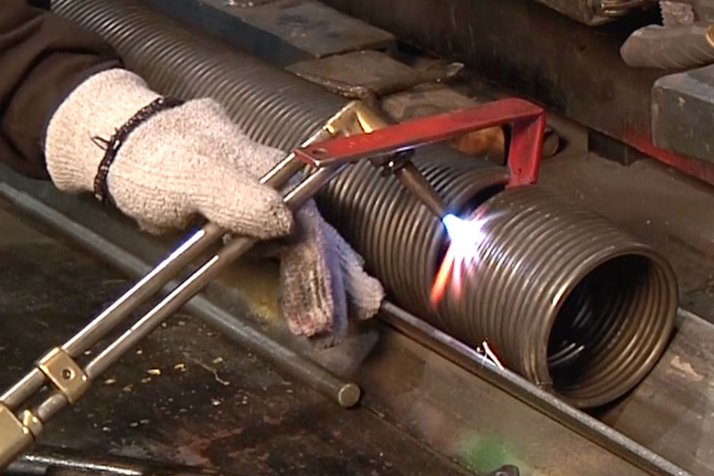 Using the spring spreader tool, you can tehn cut the spring with a torch.