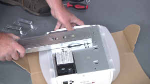 Image attaching hardware to Marantec garage door opener.