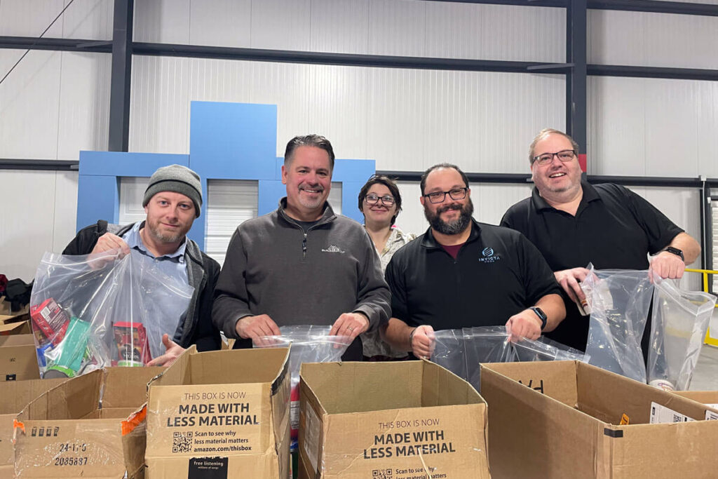 SSC IT team members packing boxes with goods