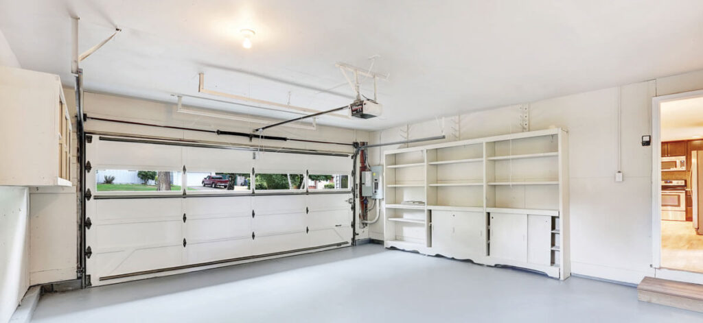 Garage door and cabinets inside a garage